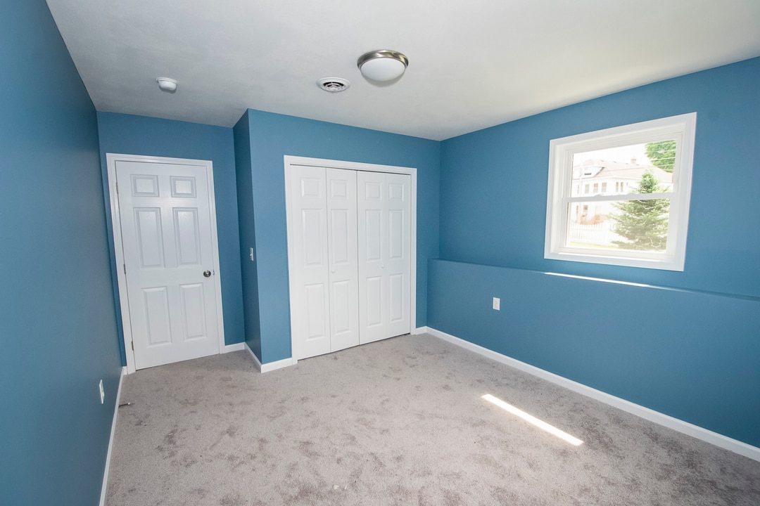 interior painting project syracuse with blue paint on bedroom